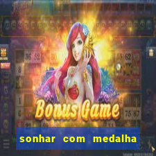 sonhar com medalha de santo